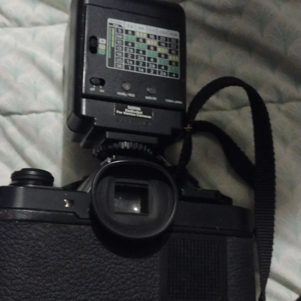 Konica Black Camera with Sunpak Flash